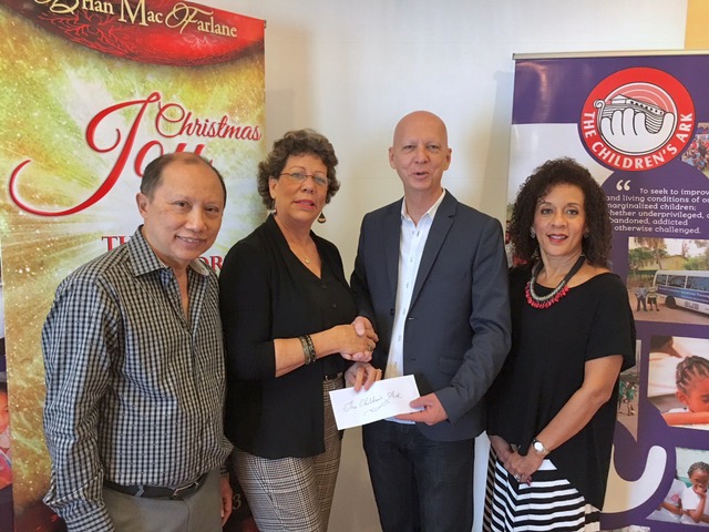 Brian MacFarlane contributes a cheque to The Children's Ark